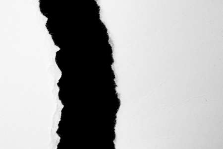 a white piece of paper on a black isolated background