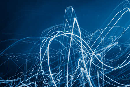 white light lines on a blue backgroundの写真素材