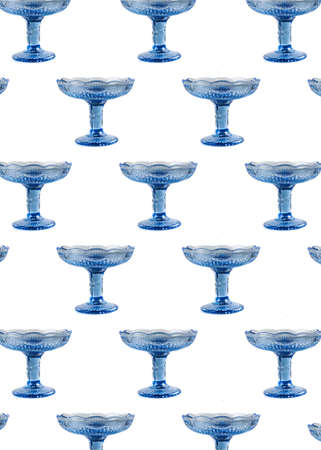 Empty blue glass vase for fruit or sweets isolated on white backgroundの写真素材