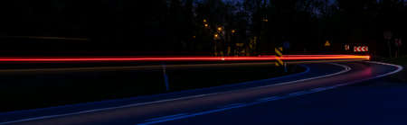 abstract red car lights at night. long exposureの写真素材