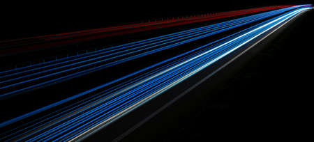 abstract red car lights at night. long exposureの写真素材