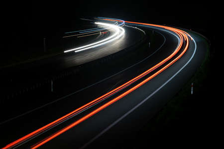 abstract red car lights at night. long exposureの写真素材