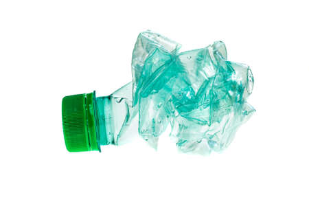 crumpled green plastic bottle on white isolated background