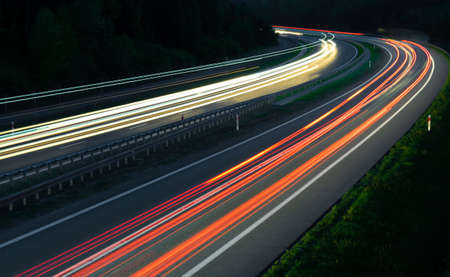 abstract red car lights at night. long exposureの写真素材