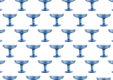 Empty blue glass vase for fruit or sweets isolated on white backgroundの写真素材