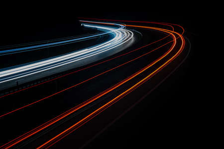 abstract red car lights at night. long exposureの写真素材