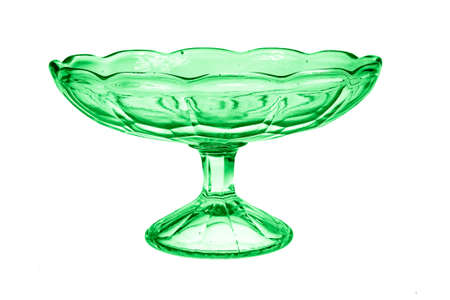 Empty green glass vase for fruit or sweets isolated on white backgroundの写真素材