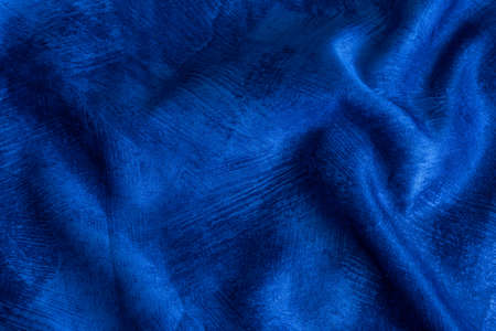 rinkled blue cotton fabric with visible textureの写真素材