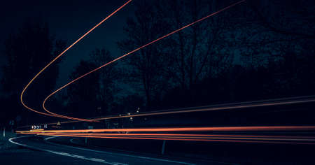 abstract red car lights at night. long exposureの写真素材