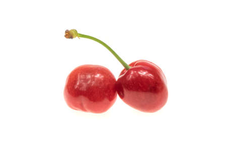 red cherries on a white isolated backgroundの写真素材