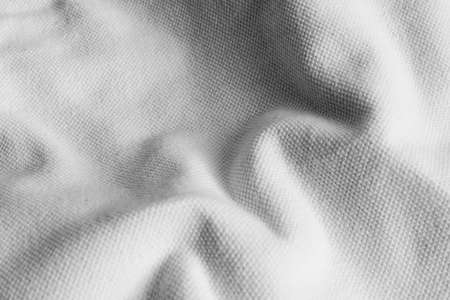 Crinkled white cotton fabric with visible textureの写真素材