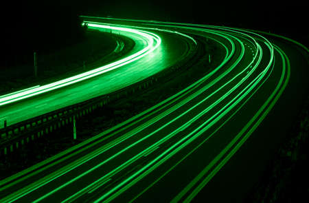 green car lights at night. long exposureの写真素材