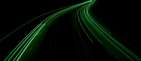 green car lights at night. long exposureの写真素材