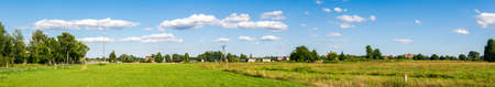 farmland on a beautiful sunny day against the background of blue skyの写真素材