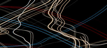 colored lines of lights on a black backgroundの写真素材
