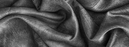 Crinkled gray cotton fabric with visible textureの写真素材