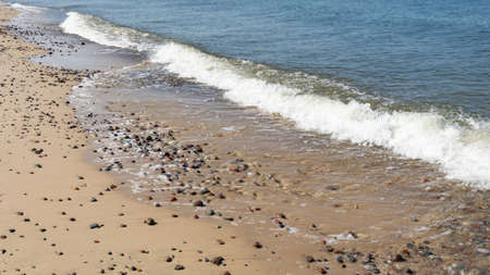 sea waves and stones on the beachの写真素材