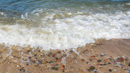 sea waves and stones on the beachの写真素材
