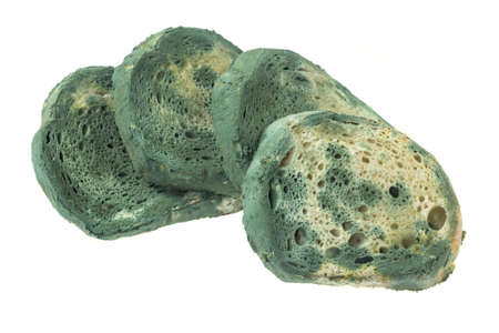 moldy slices of bread on the white isolated backgroundの写真素材