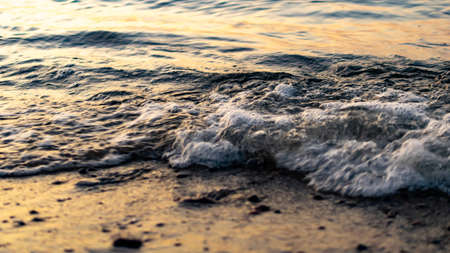 nice sea waves highlighted by sunset. backgroundの写真素材