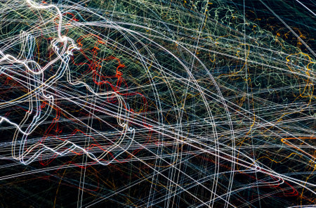 colored lines of lights on a black backgroundの写真素材