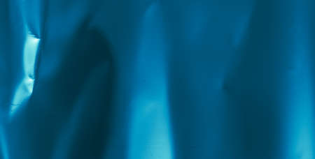 crinkled blue foil with visible details. background or textureの写真素材