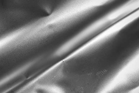silver crinkled foil with visible texture. backgroundの写真素材