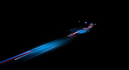 abstract red car lights at night. long exposureの写真素材