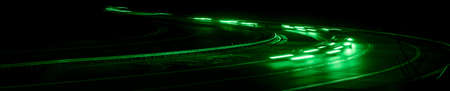 green car lights at night. long exposureの写真素材