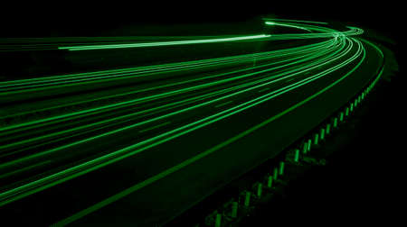 green car lights at night. long exposureの写真素材
