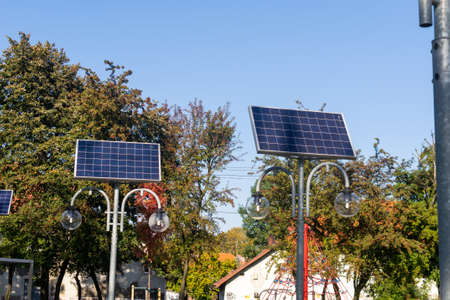photovoltaic panels powering the lighting of street lamps in the parkの写真素材