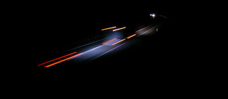 abstract red car lights at night. long exposureの写真素材
