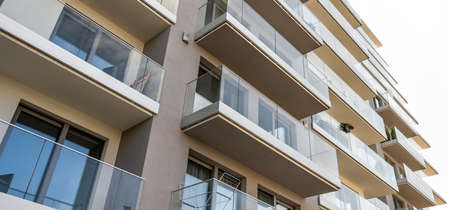 modern building on a background of white cloudsの写真素材
