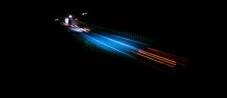 abstract red car lights at night. long exposureの写真素材