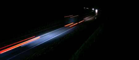 abstract red car lights at night. long exposureの写真素材