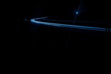 blue car lights at night. long exposureの写真素材