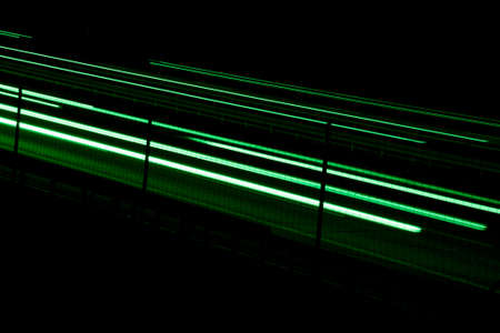 green car lights at night. long exposureの写真素材