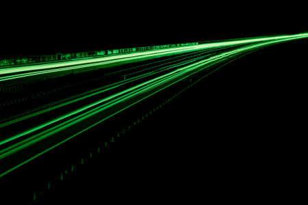green car lights at night. long exposureの写真素材
