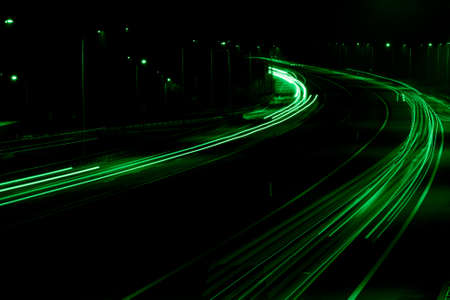 green car lights at night. long exposureの写真素材