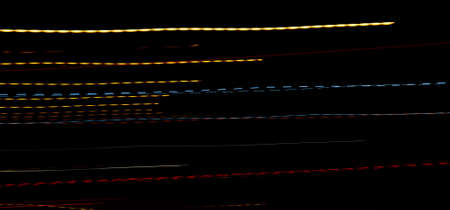 colored lines on a black background. texturaの写真素材