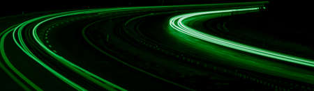 green car lights at night. long exposureの写真素材