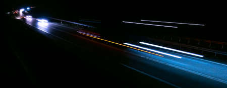 abstract red car lights at night. long exposureの写真素材