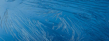 sheet metal painted blue with an interesting patternの写真素材