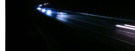 abstract red car lights at night. long exposureの写真素材