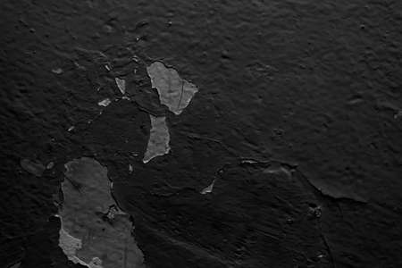 the wall is painted with black paint. backgroundの写真素材