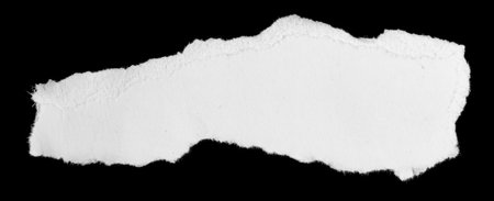 a white piece of paper on a black isolated backgroundの写真素材