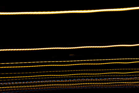 colored lines on a black background. texturaの写真素材