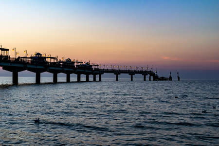 pier against the backdrop of a nice sunset skyの写真素材