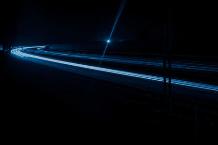 blue car lights at night. long exposureの写真素材