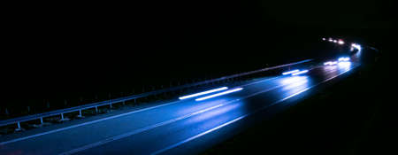 abstract red car lights at night. long exposureの写真素材